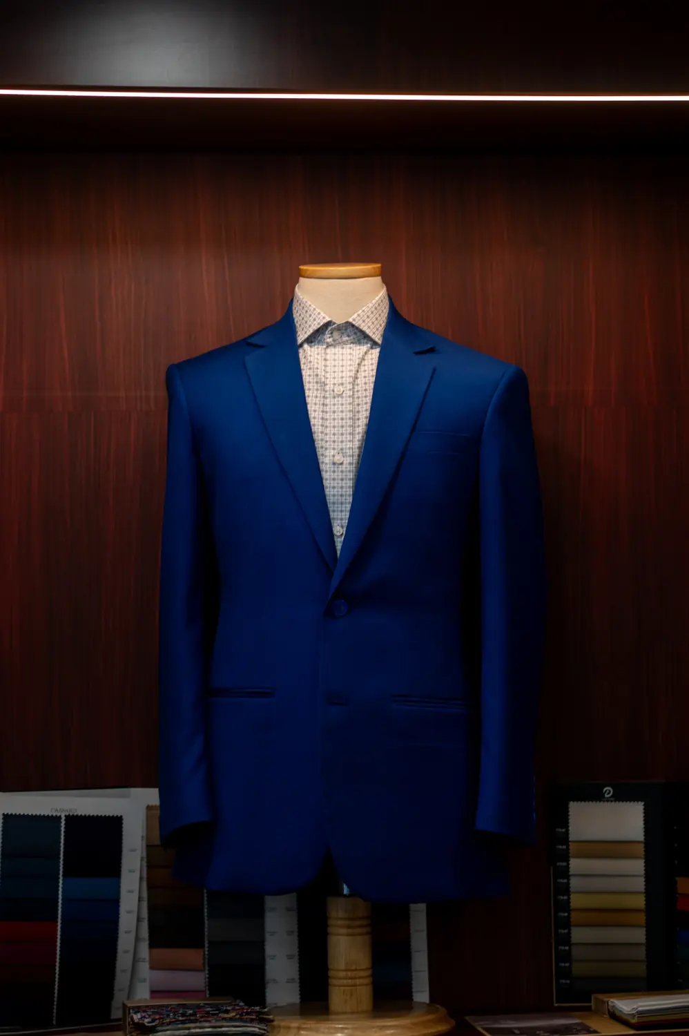 Blue tailored suit displayed in the Sawasdee showroom