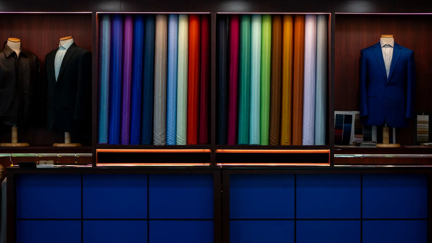 Custom suits and colourful fabrics displayed in The Sawasdee showroom